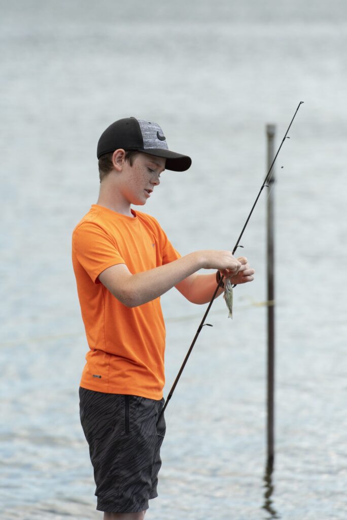 Kid caught fish off the shore at Miller's Family Camp
