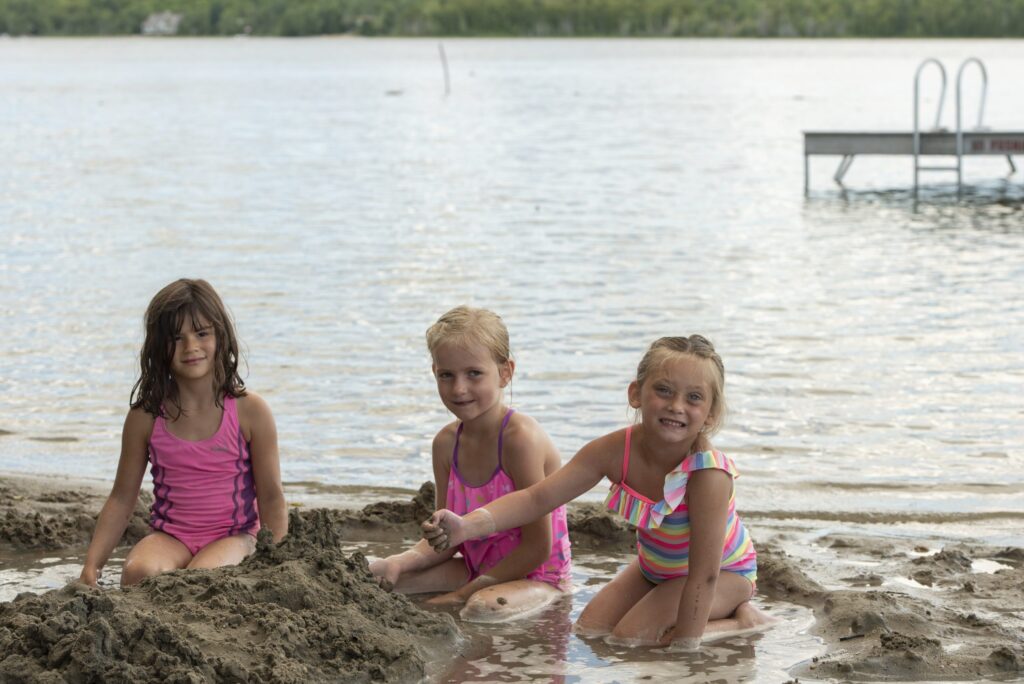 Kids building sandcastle at Miller's Family Camp